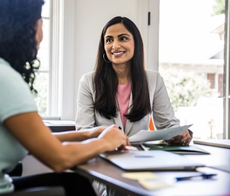 Business person talking to client in office