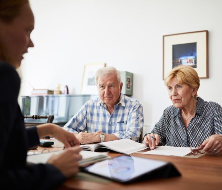 Elderly couple meeting with financial professional