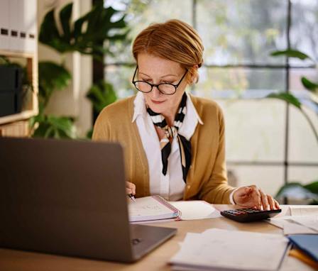Payroll accountant taking notes