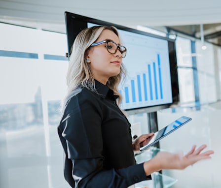 Professional woman presenting bar graph