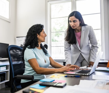 Two women talking in an office